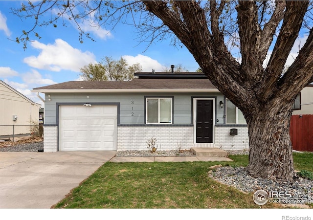 312 21st Avenue Ct, Greeley, CO 80631 - view of front of property with brick siding, a garage, and concrete driveway