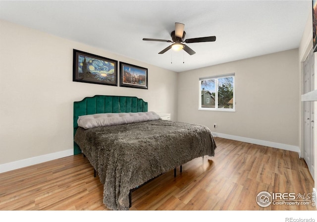 312 21st Avenue Ct, Greeley, CO 80631 - bedroom with baseboards, wood finished floors, and a ceiling fan