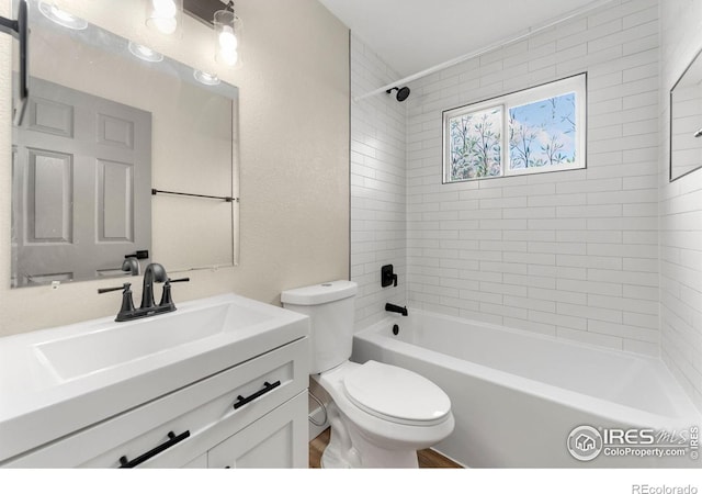 312 21st Avenue Ct, Greeley, CO 80631 - bathroom featuring toilet, vanity, and shower / bathtub combination
