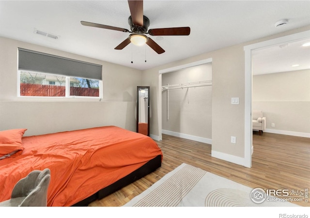 312 21st Avenue Ct, Greeley, CO 80631 - bedroom featuring wood finished floors, a closet, baseboards, and a ceiling fan