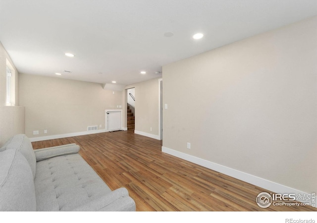 312 21st Avenue Ct, Greeley, CO 80631 - living area with stairway, wood finished floors, recessed lighting, and baseboards
