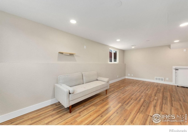 312 21st Avenue Ct, Greeley, CO 80631 - sitting room featuring light wood finished floors, baseboards, and recessed lighting