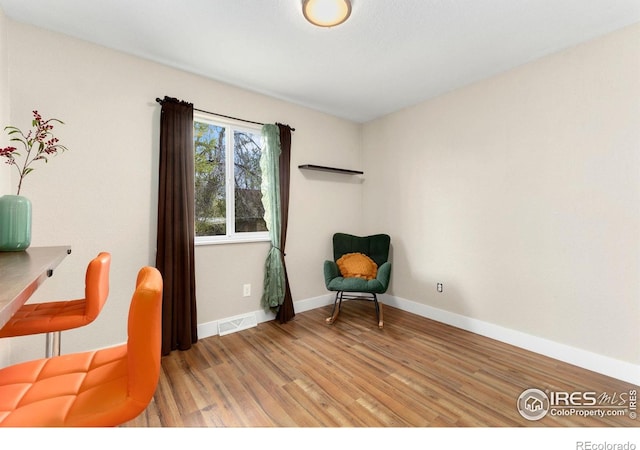 312 21st Avenue Ct, Greeley, CO 80631 - sitting room featuring light wood-style flooring and baseboards