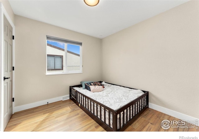 312 21st Avenue Ct, Greeley, CO 80631 - bedroom featuring light wood-style floors and baseboards