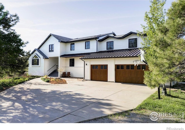4932 Valkyrie Dr, Boulder, CO 80301 - view of front of property with driveway, a standing seam roof, an attached garage, and metal roof