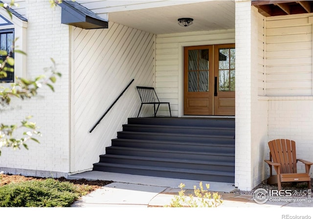 4932 Valkyrie Dr, Boulder, CO 80301 - view of exterior entry featuring french doors and brick siding