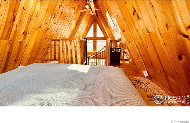 867 Windy Ridge Rd, Red Feather Lakes, CO 80545 - bedroom with wood walls and vaulted ceiling