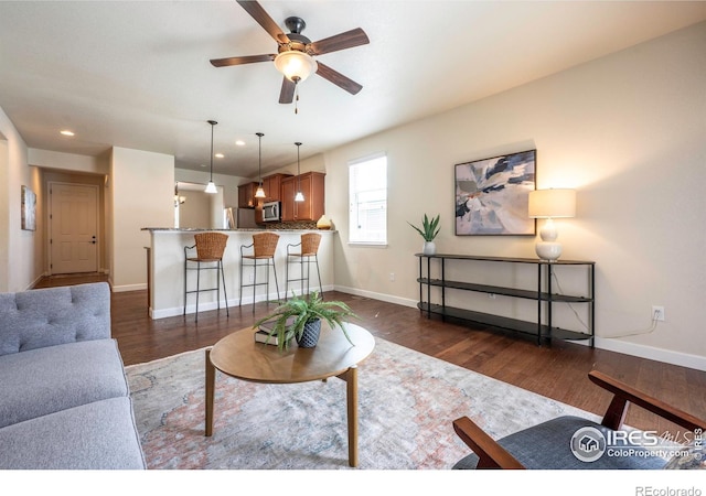 1358 14th Ave, Longmont, CO 80501 - living area featuring dark wood finished floors, ceiling fan, recessed lighting, and baseboards