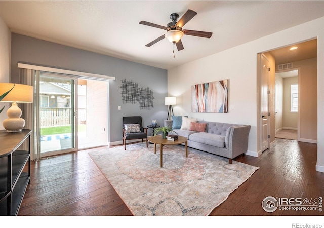 1358 14th Ave, Longmont, CO 80501 - living area with a ceiling fan, dark wood finished floors, and baseboards