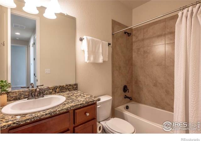 1358 14th Ave, Longmont, CO 80501 - bathroom featuring toilet, shower / bathtub combination with curtain, and vanity
