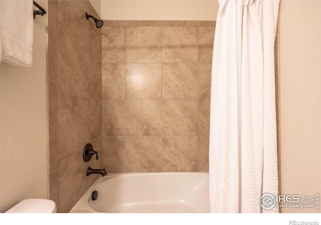 1358 14th Ave, Longmont, CO 80501 - bathroom featuring shower / tub combo and toilet