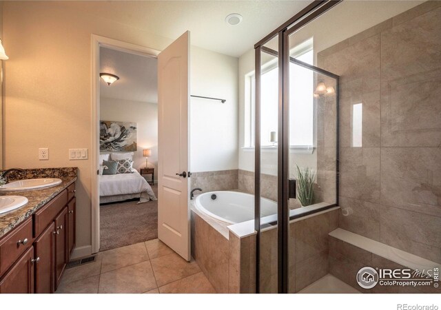1358 14th Ave, Longmont, CO 80501 - full bath with a stall shower, tile patterned flooring, ensuite bath, a bath, and double vanity