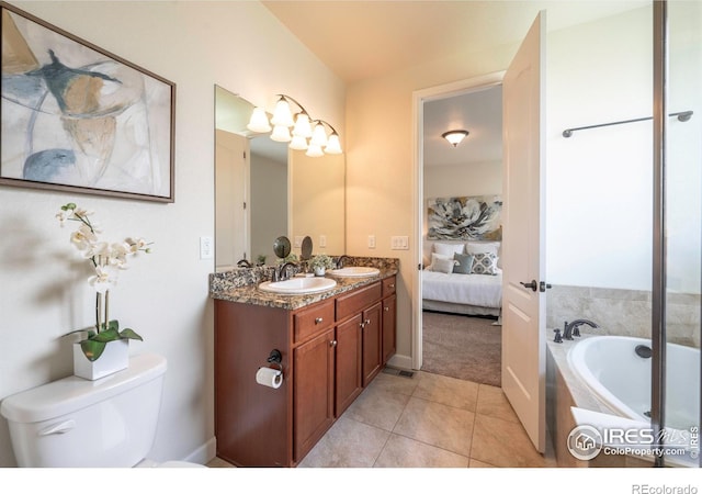 1358 14th Ave, Longmont, CO 80501 - ensuite bathroom featuring toilet, tile patterned floors, double vanity, a bath, and baseboards