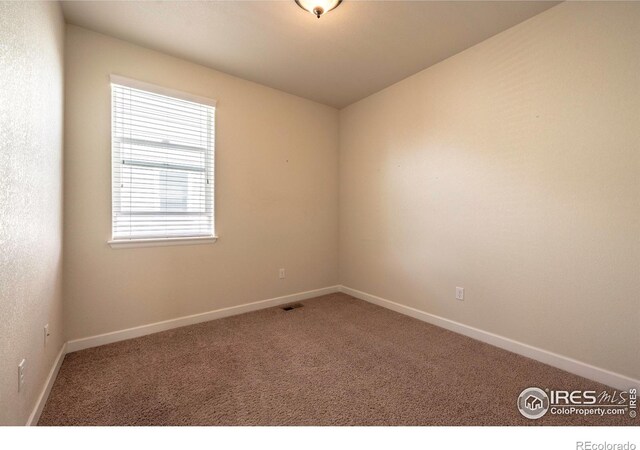 1358 14th Ave, Longmont, CO 80501 - carpeted empty room featuring baseboards
