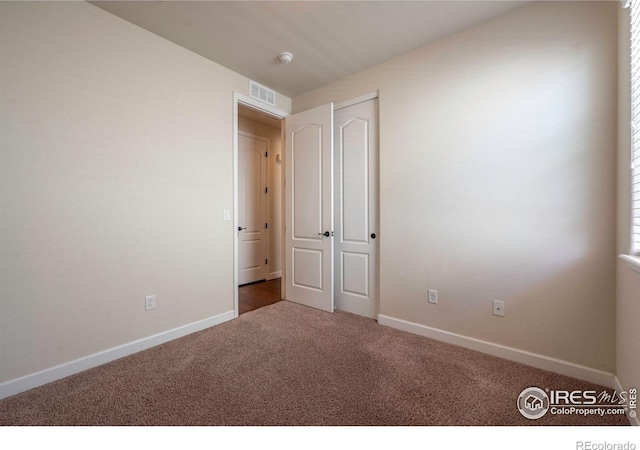 1358 14th Ave, Longmont, CO 80501 - unfurnished bedroom with carpet floors and baseboards