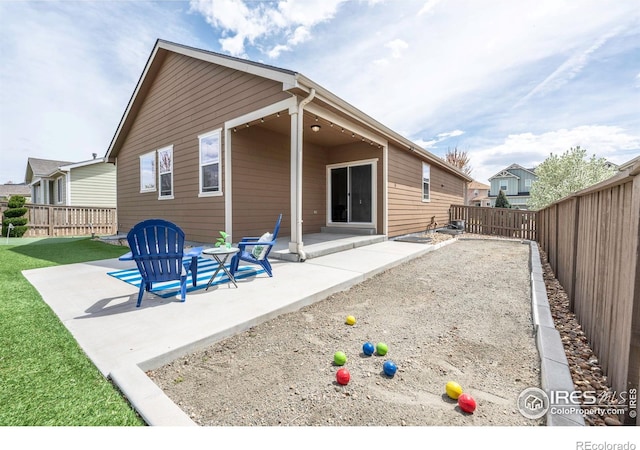 1358 14th Ave, Longmont, CO 80501 - rear view of house featuring a fenced backyard and a patio