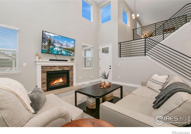 1203 Cabot Ct, Fort Collins, CO 80526 - living area featuring stairway, a fireplace, plenty of natural light, baseboards, and a high ceiling