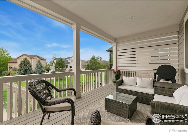 1203 Cabot Ct, Fort Collins, CO 80526 - wooden deck featuring outdoor lounge area and a residential view