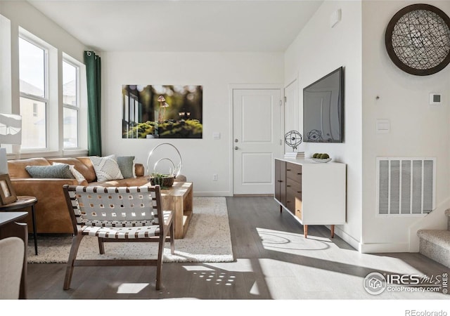 18722 E 99th Ave, Commerce City, CO 80022 - living area featuring dark wood-type flooring and baseboards