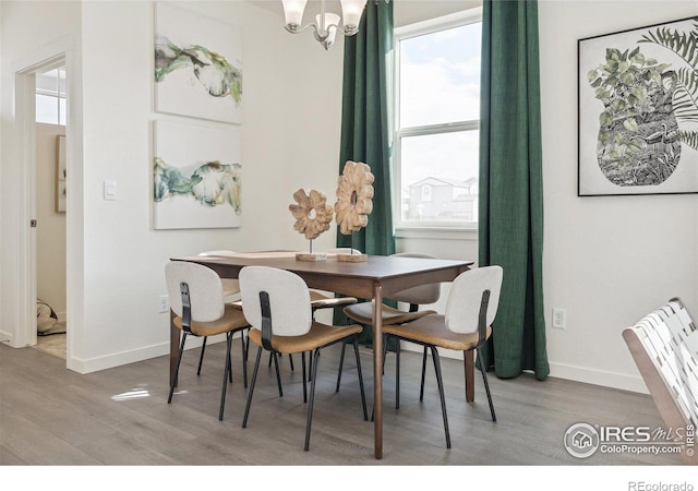18722 E 99th Ave, Commerce City, CO 80022 - dining space featuring wood finished floors and baseboards