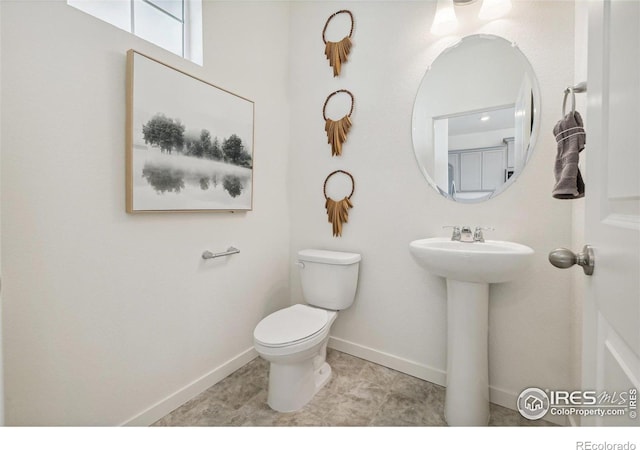 18722 E 99th Ave, Commerce City, CO 80022 - bathroom with toilet and baseboards