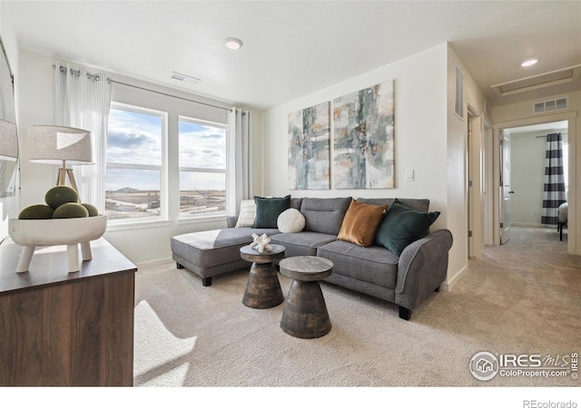 18722 E 99th Ave, Commerce City, CO 80022 - carpeted living room with baseboards and attic access