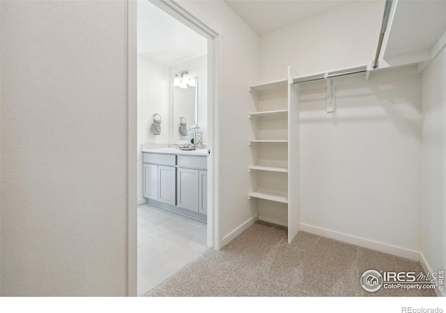 18722 E 99th Ave, Commerce City, CO 80022 - walk in closet featuring light carpet