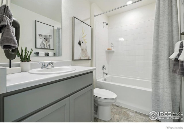 18722 E 99th Ave, Commerce City, CO 80022 - full bath with toilet, shower / tub combo with curtain, vanity, and stone finish floors