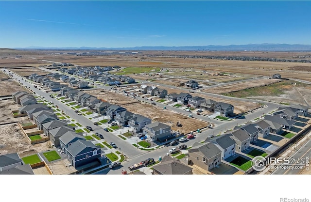 18722 E 99th Ave, Commerce City, CO 80022 - aerial view of property's location with nearby suburban area and mountains