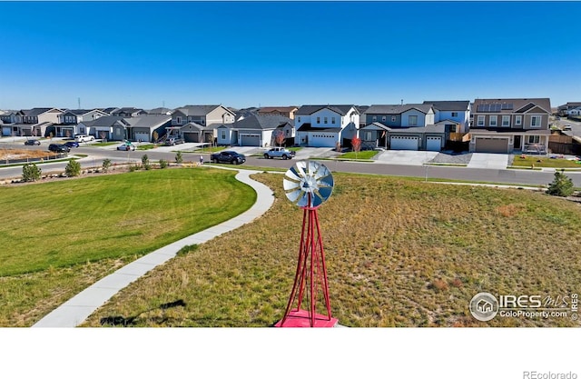 18722 E 99th Ave, Commerce City, CO 80022 - view of green lawn featuring a residential view and driveway