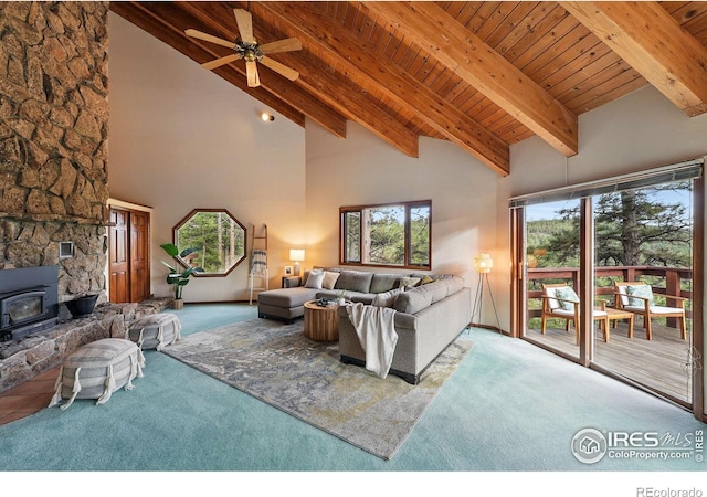 1101 Peakview Cir, Boulder, CO 80302 - carpeted living room featuring a wood stove, wood ceiling with exposed beams, high vaulted ceiling, and ceiling fan