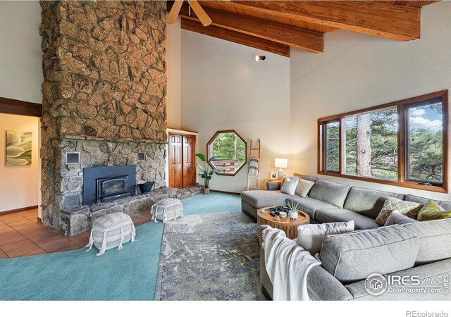 1101 Peakview Cir, Boulder, CO 80302 - living area featuring high vaulted ceiling, wood ceiling with exposed beams, and baseboards