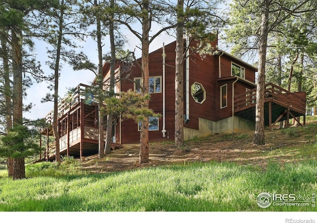 1101 Peakview Cir, Boulder, CO 80302 - view of home's exterior featuring a wooden deck and stairs