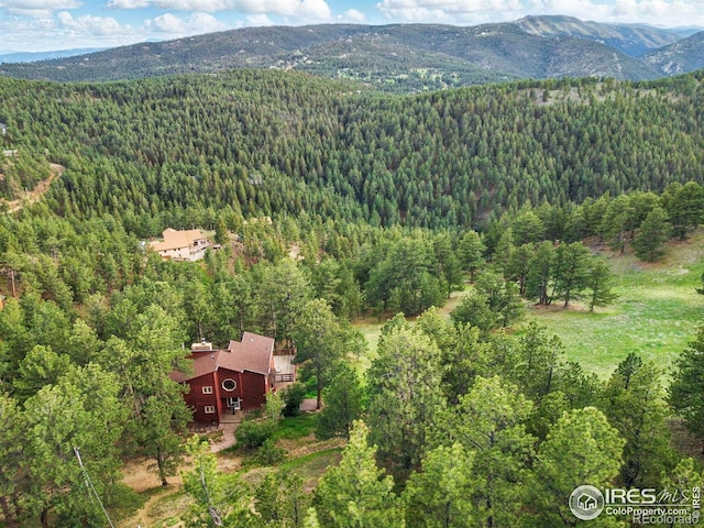 1101 Peakview Cir, Boulder, CO 80302 - aerial view of property and surrounding area featuring a heavily wooded area and a mountain backdrop