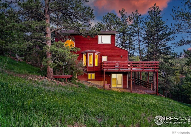1101 Peakview Cir, Boulder, CO 80302 - back of property at dusk featuring a wooden deck