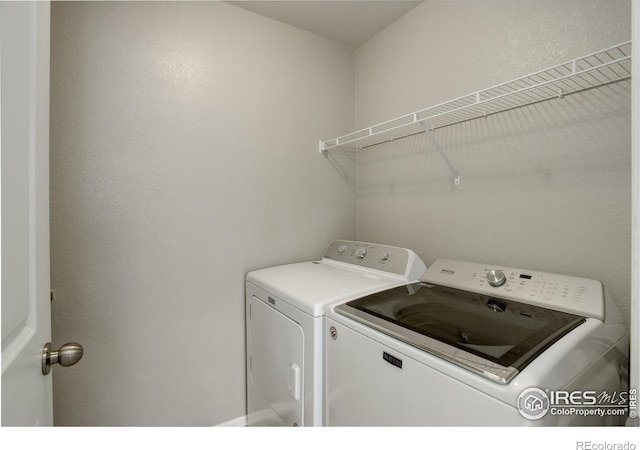 1540 Murrlet St, Berthoud, CO 80513 - laundry room featuring washing machine and dryer