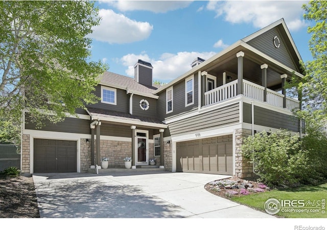 4109 Frederick Cir, Longmont, CO 80503 - view of front of property with a garage, stone siding, and driveway