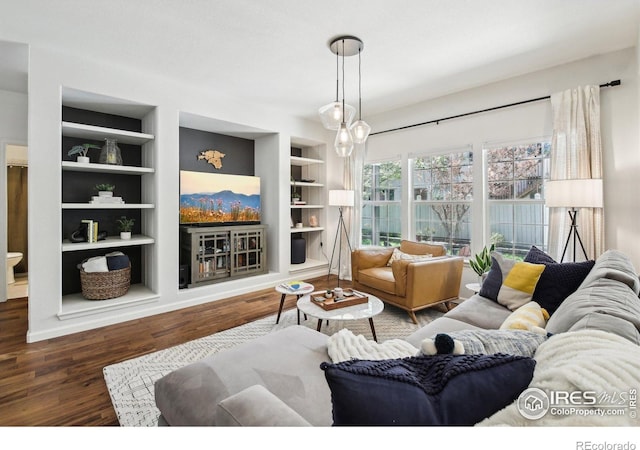 4109 Frederick Cir, Longmont, CO 80503 - living room with built in shelves and wood finished floors