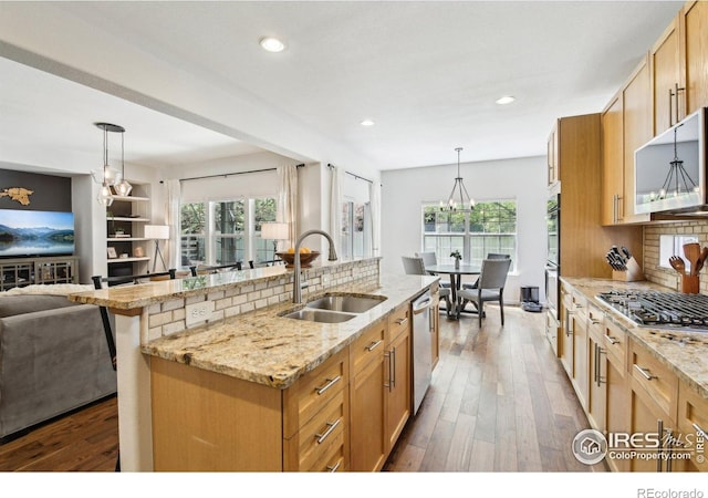 4109 Frederick Cir, Longmont, CO 80503 - kitchen featuring a sink, stainless steel appliances, wood-type flooring, tasteful backsplash, and recessed lighting