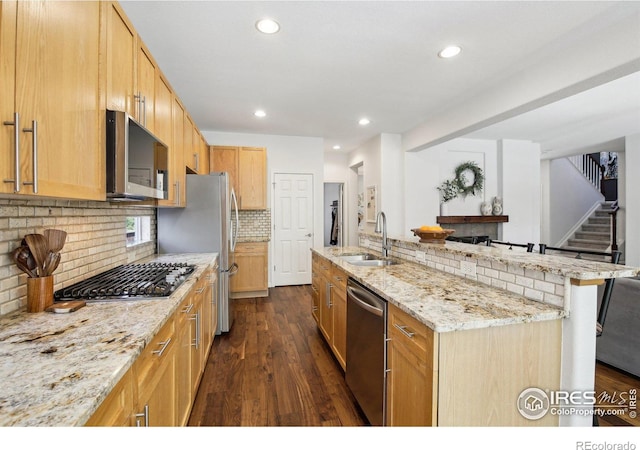 4109 Frederick Cir, Longmont, CO 80503 - kitchen featuring appliances with stainless steel finishes, recessed lighting, backsplash, dark wood-style floors, and a sink