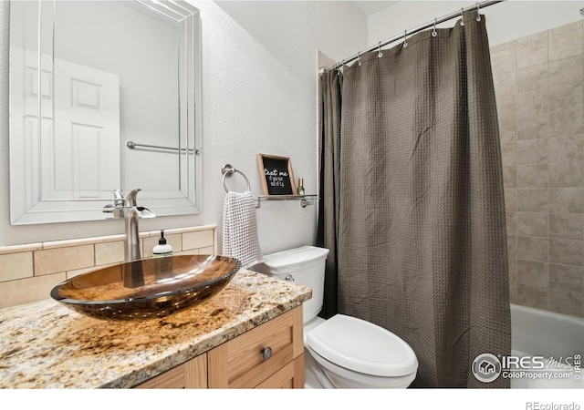 4109 Frederick Cir, Longmont, CO 80503 - bathroom with toilet, tasteful backsplash, vanity, and shower / bath combo with shower curtain