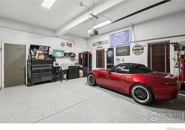 4109 Frederick Cir, Longmont, CO 80503 - garage featuring a garage door opener