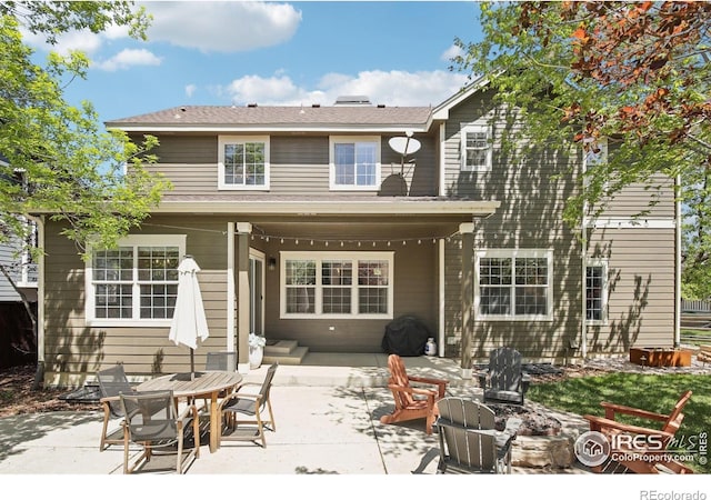 4109 Frederick Cir, Longmont, CO 80503 - rear view of property featuring a patio area and an outdoor fire pit