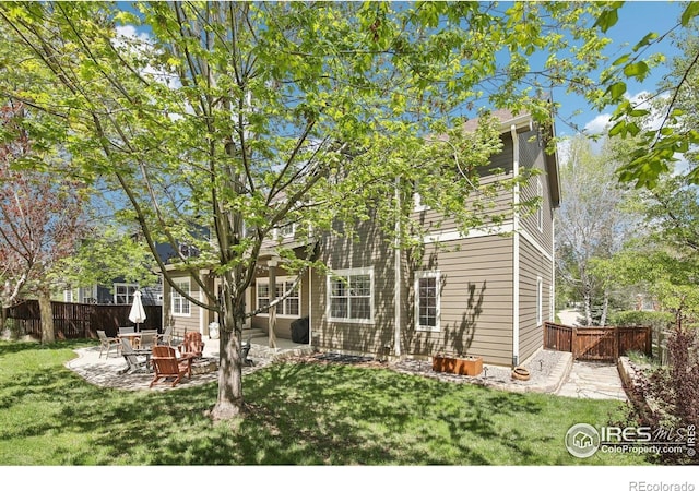 4109 Frederick Cir, Longmont, CO 80503 - rear view of house with a patio area