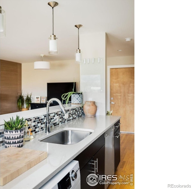 1201 Balsam Ave Unit 302, Boulder, CO 80304 - kitchen featuring a sink, light countertops, light wood-style floors, hanging light fixtures, and dishwashing machine