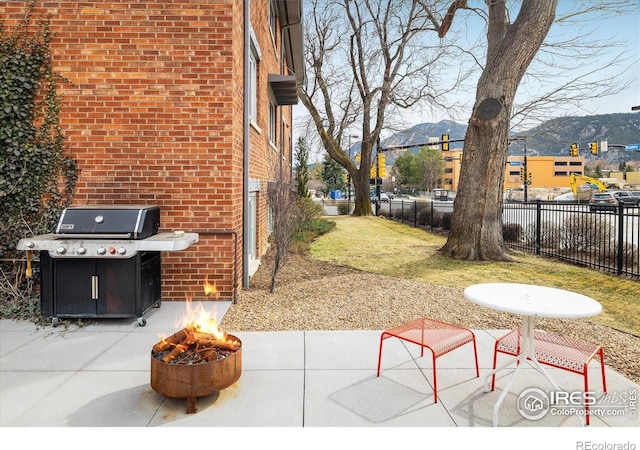 1201 Balsam Ave Unit 302, Boulder, CO 80304 - view of yard featuring an outdoor fire pit, a patio, and a mountain view