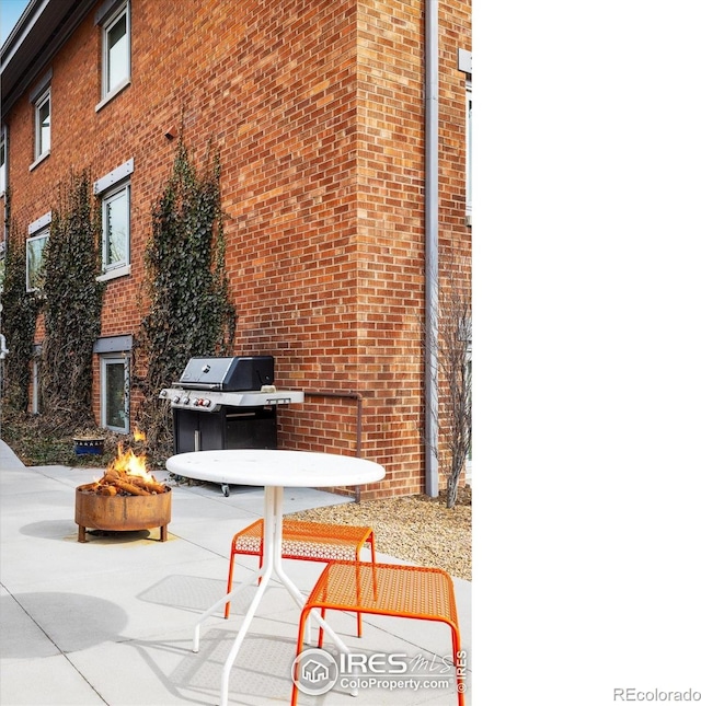 1201 Balsam Ave Unit 302, Boulder, CO 80304 - view of patio with a fire pit and a grill