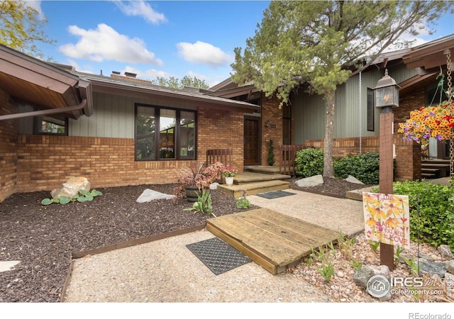 4456 W Pioneer Dr, Greeley, CO 80634 - view of exterior entry featuring brick siding