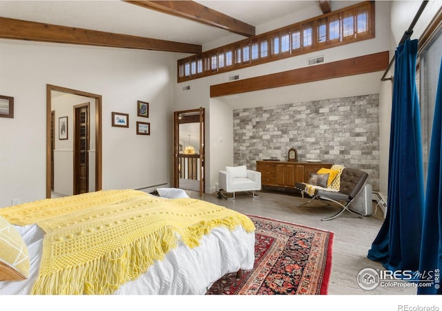 4456 W Pioneer Dr, Greeley, CO 80634 - bedroom featuring wood finished floors and beam ceiling