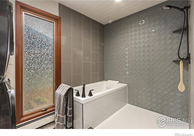 4456 W Pioneer Dr, Greeley, CO 80634 - bathroom featuring a tile shower, a baseboard radiator, tile walls, and a garden tub